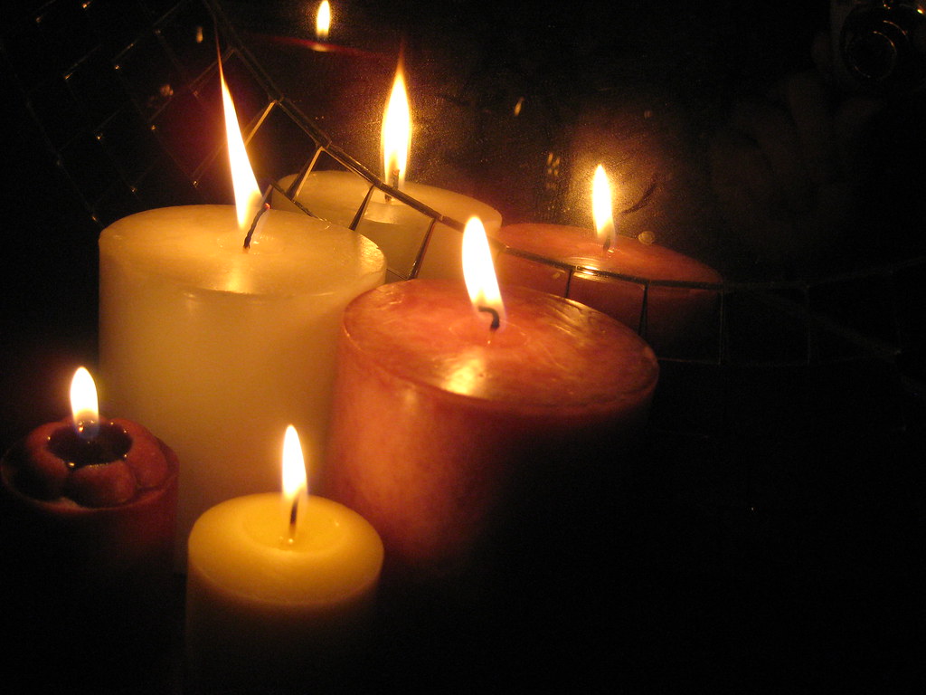 A lit candle in soft light
